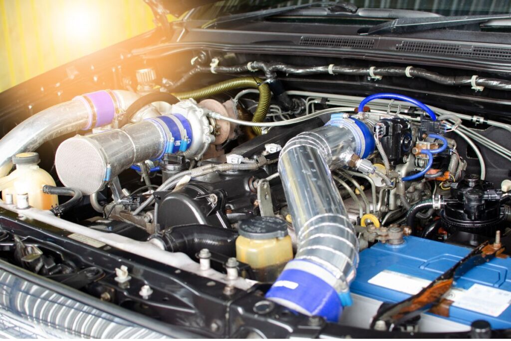 What vehicles used the M104 engine