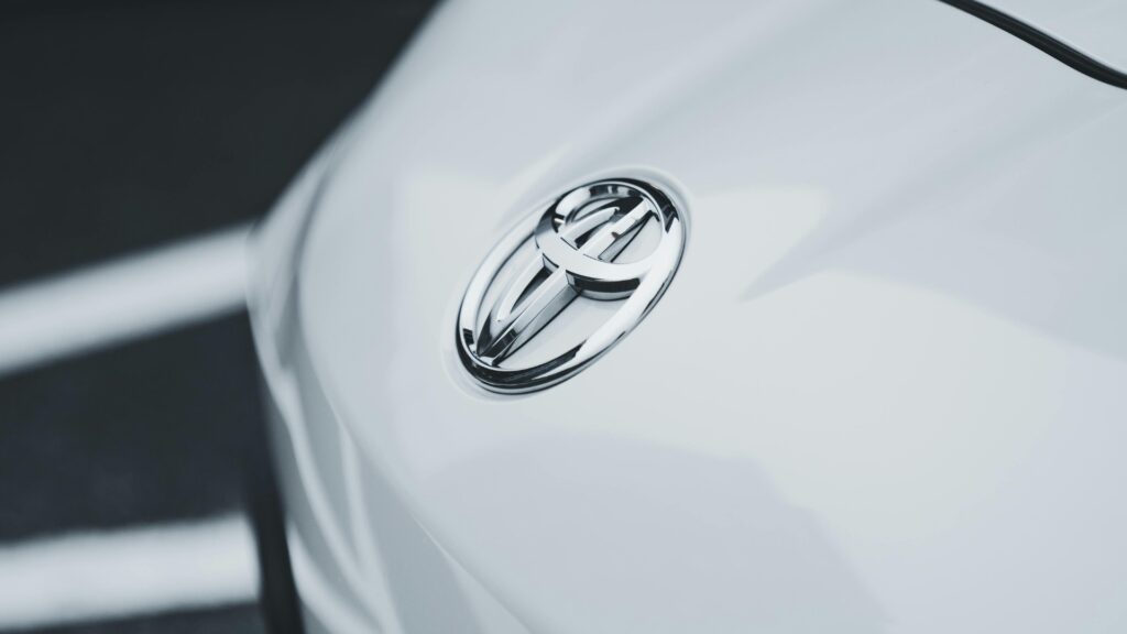 Close-up of the Toyota emblem on a white vehicle