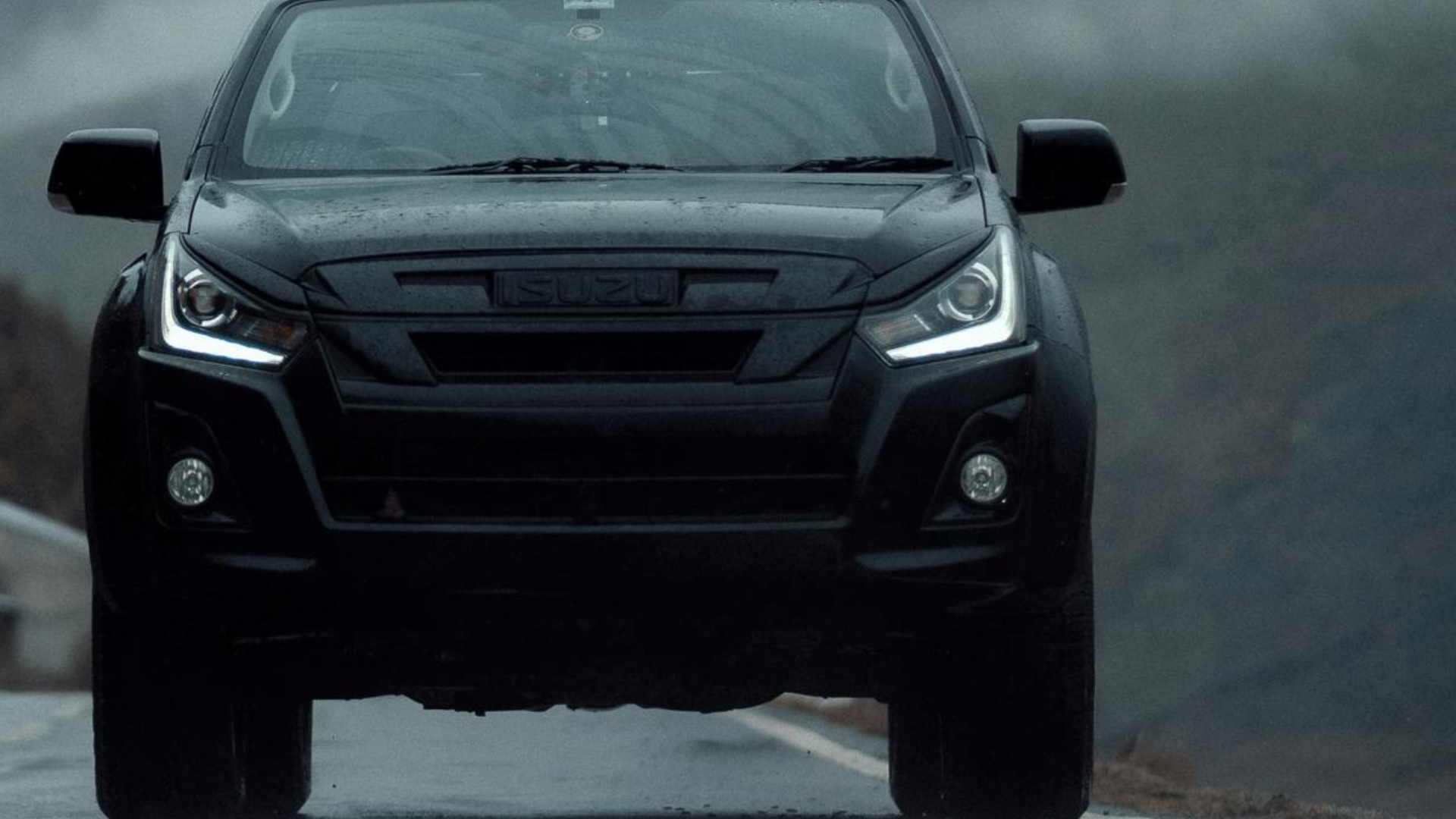 Isuzu vehicle on the road