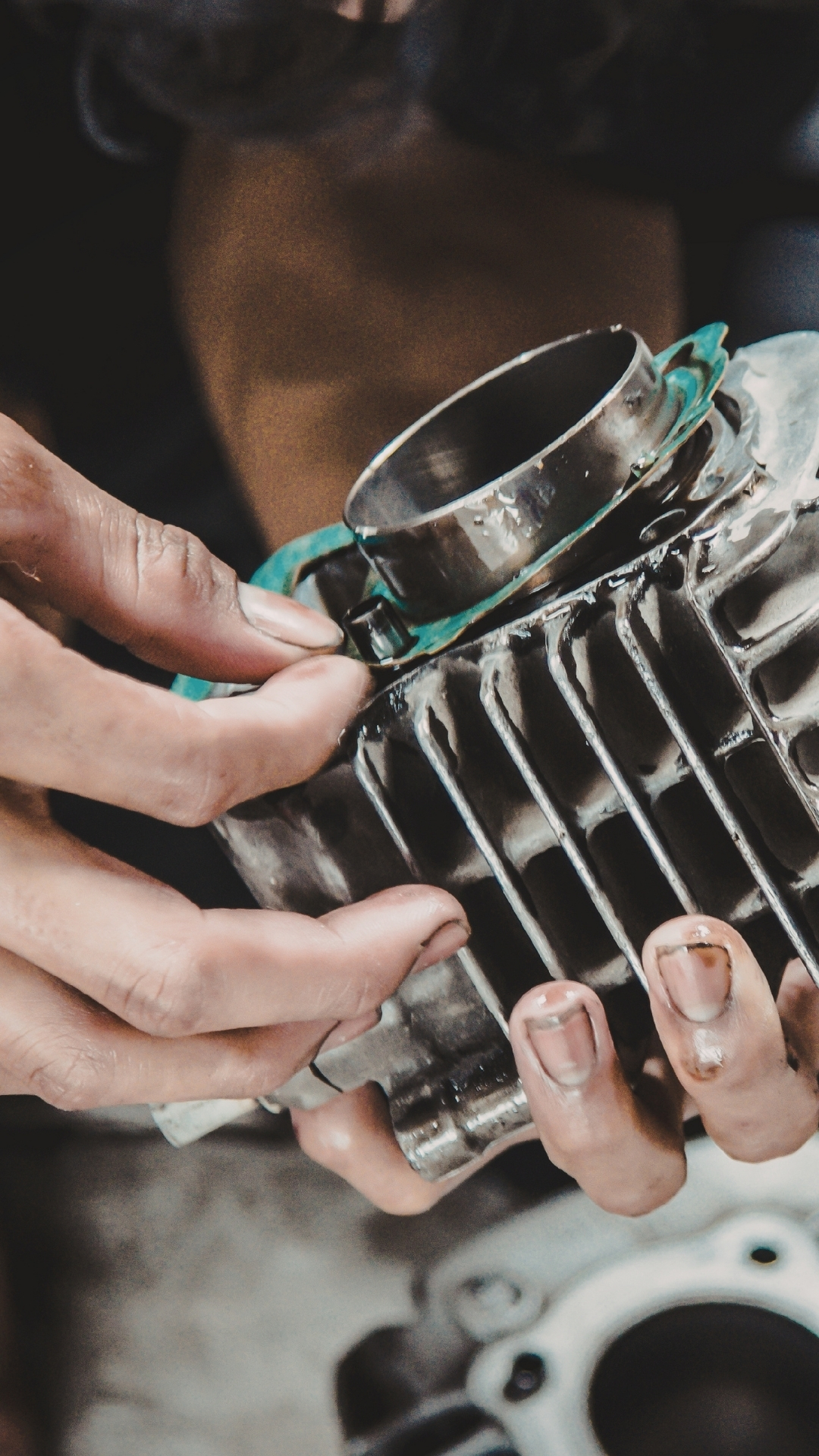 Mechanic checking engine component fitment